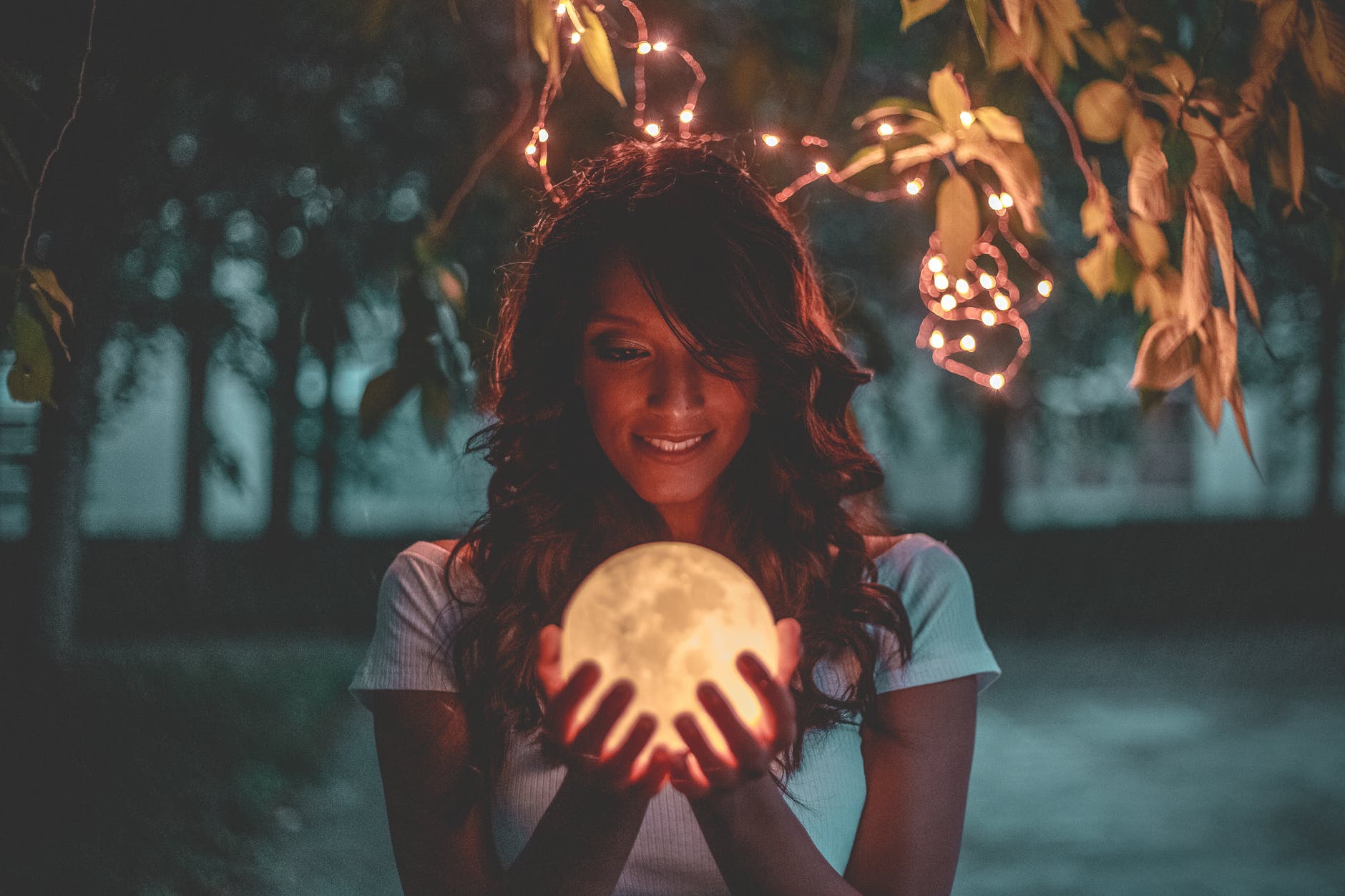 woman holding moon lamp